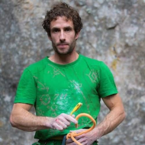 Patxi Usobiaga, pro climber and Rockbusters coach, at the crag with quickdraws